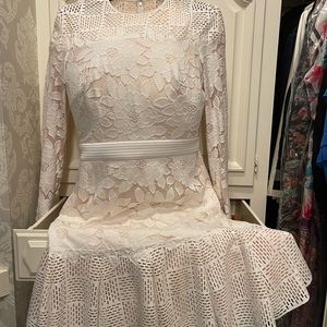 Beautiful white  lace cut dress. So comfortable, travels beautifully.